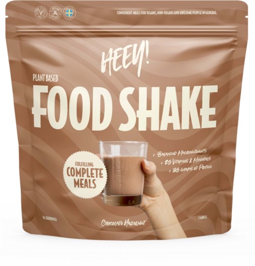 A brown pouch with a glass of chocolate drink, labeled "HEEY! FOOD SHAKE" for plant-based complete meals.