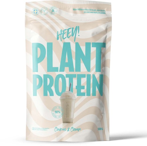 Packaging for plant protein supplement with a picture of a smoothie and blue text. The bag is beige with wave patterns.