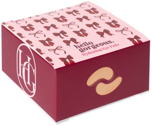 Rosa eske med blomstermønster og gull øyemaske, merket Nella Gorgeous Hydrating Eye Pads.