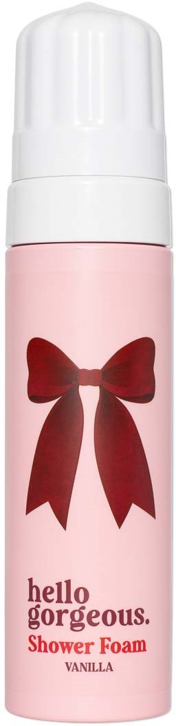 Pink dusjskumflaske med en rød sløyfe og tekst hello gorgeous shower foam vanilla.