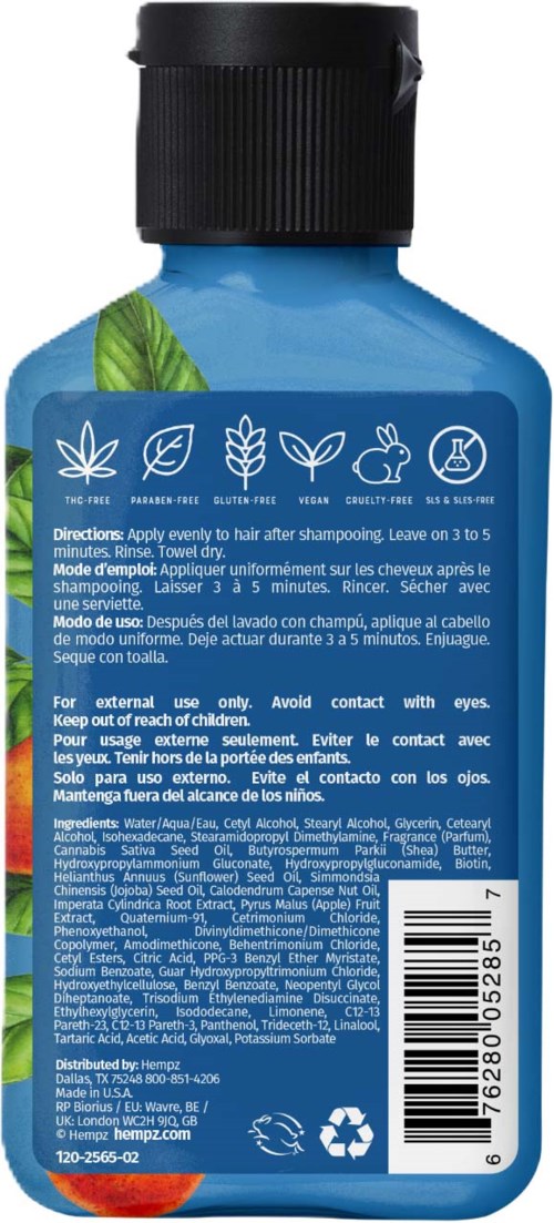 Blue shampoo bottle with green leaf graphics, contains herbal hair care product for external use, with instructions and ingredients listed.