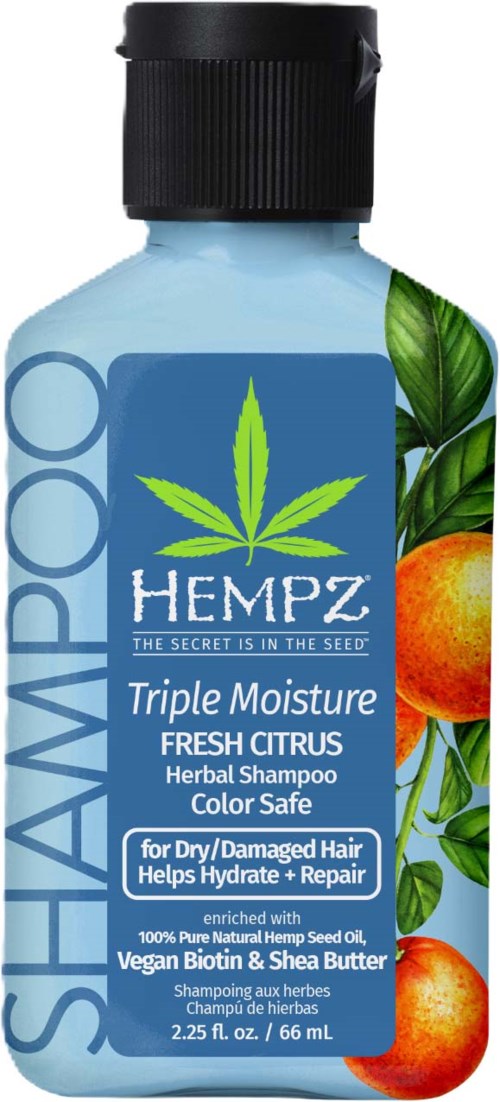 A bottle of hempz herbal shampoo with orange and green citrus and leaf illustrations, labeled as moisturizing and color safe.