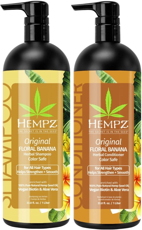 Two black bottles with pump tops, labels show a green cannabis leaf and banana images, mentioning herbal shampoo and conditioner.