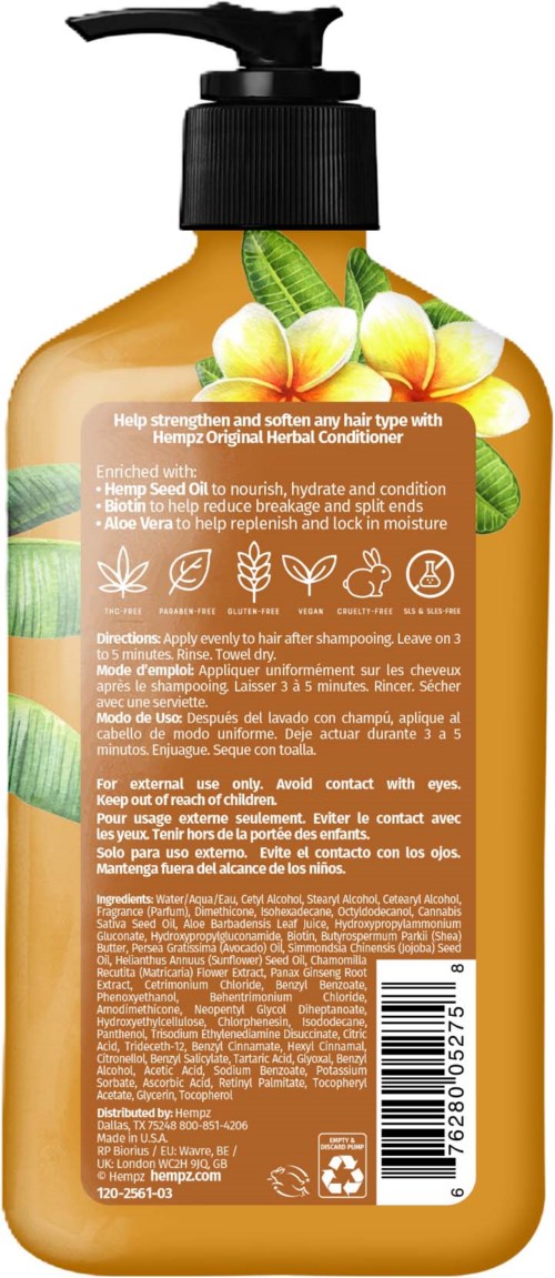 A brown shampoo bottle with a black pump, decorated with yellow flowers and green leaves, and text on the label.