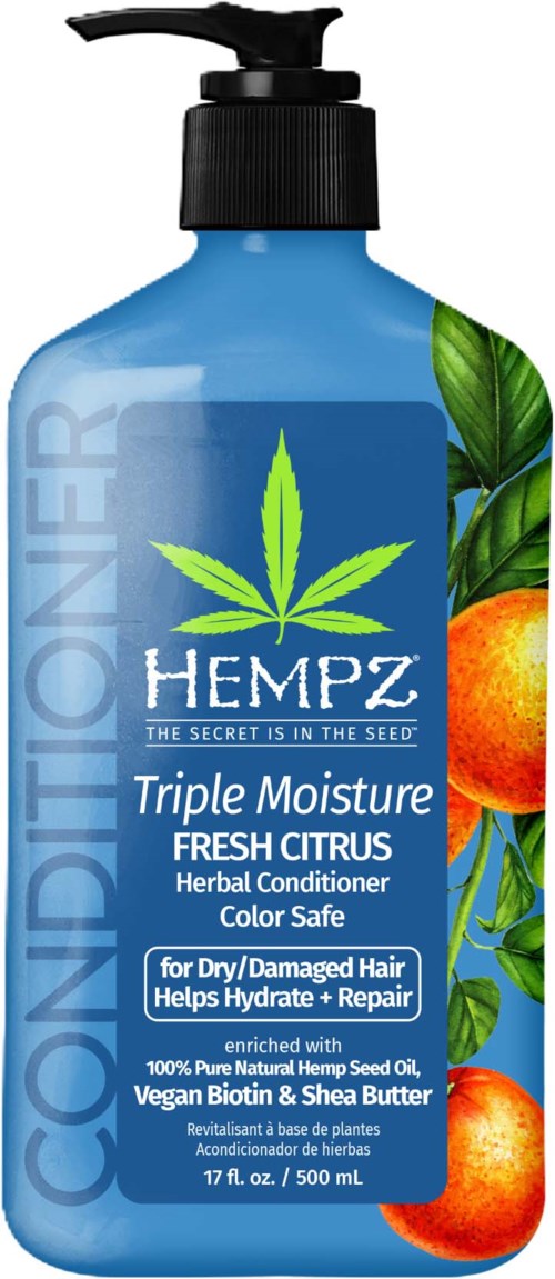 A blue bottle of hempz conditioner with orange and green citrus and leaf images, labeled for dry, damaged hair.