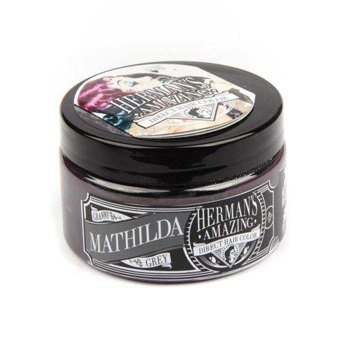 A jar of Mathilda Hermann's Grey hair color, black lid, label with decorative borders and text.