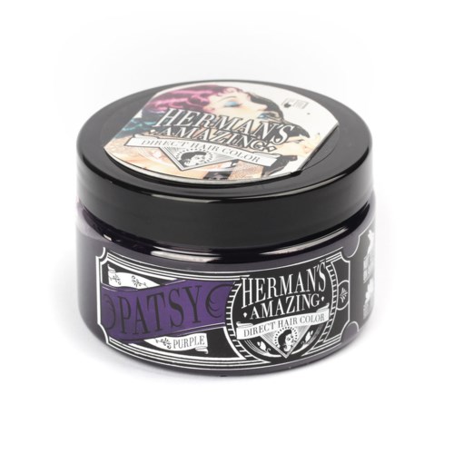 A black container with purple and white label, showing a woman with pink hair and text about hair color.