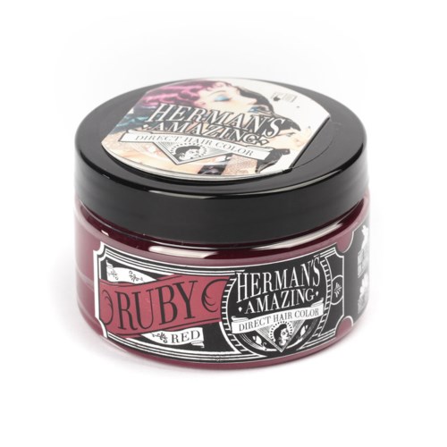 A small jar of Herman's Amazing Ruby Red hair color with a black lid and decorative label.