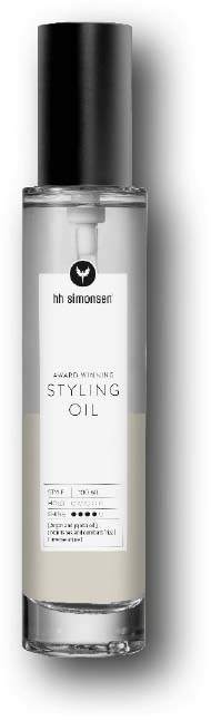 En klar flaske med stylingolje med svart lokk, merket med merke og produktinformasjon.