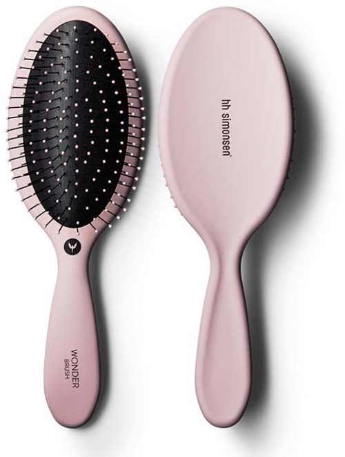 Eine rosa Haarbürste mit schwarzer Bürstenseite und schlichter rosa Rückseite, beschriftet 'Wow Wonder' und 'hi sismisen.'