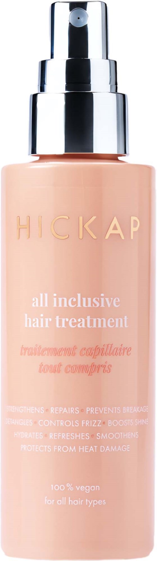 A peach-colored bottle of hair treatment spray with a silver pump, labeled 'HICKAP all inclusive hair treatment.'