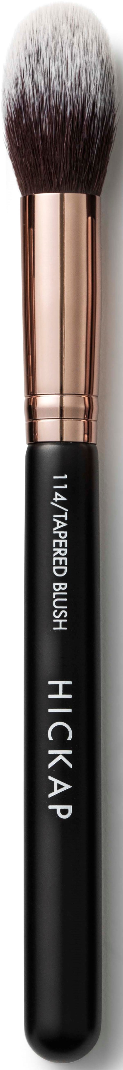 A makeup brush with black, white, and copper colors, designed for applying cosmetics.