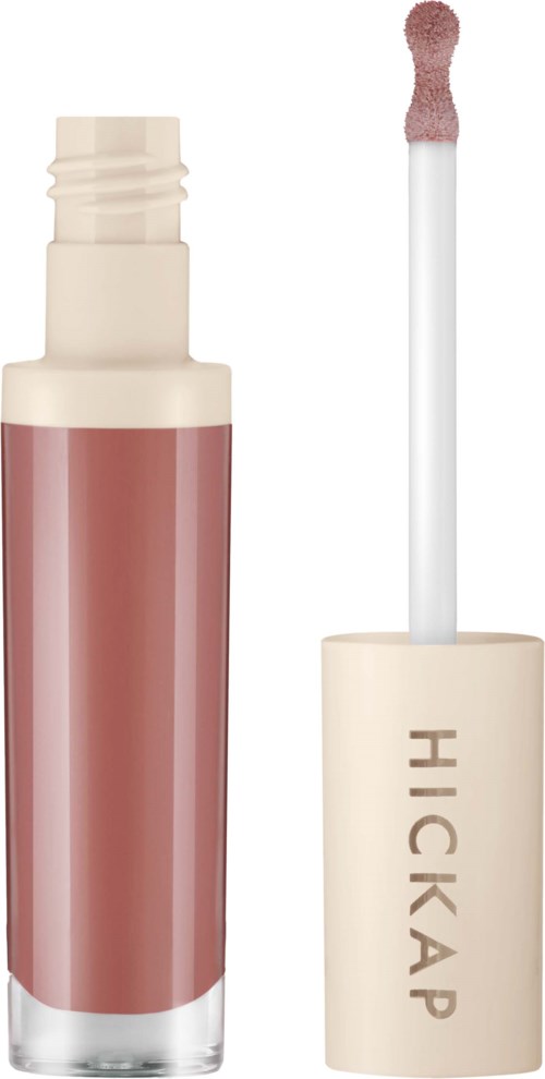 Liquid lipstick tube with a soft applicator brush beside it.