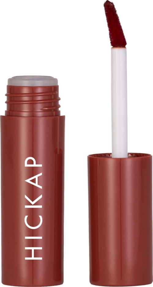 A lipstick tube with its cap off, showing the lip gloss applicator with red gloss.