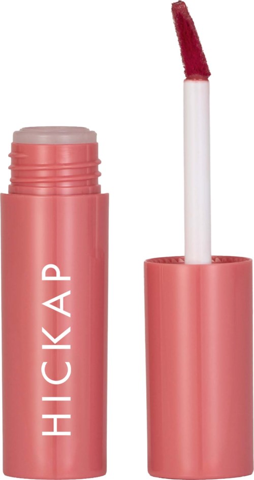 A pink Lip gloss tube with the wand and applicator outside, ready to use.