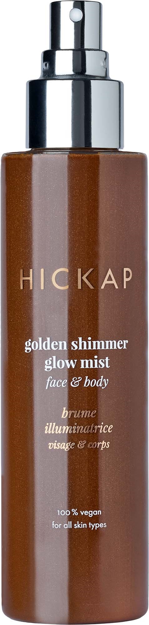 A brown spray bottle with a silver cap, labeled Hickap golden shimmer glow mist for face and body.