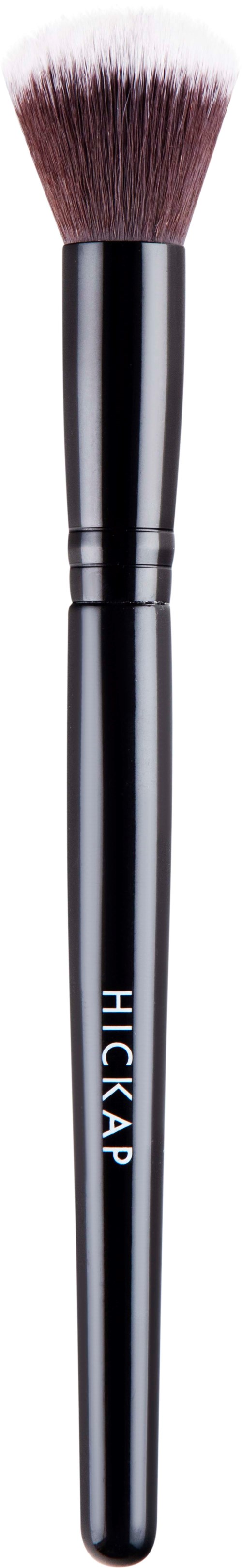 A makeup brush with a black handle and fluffy white and pink bristles.