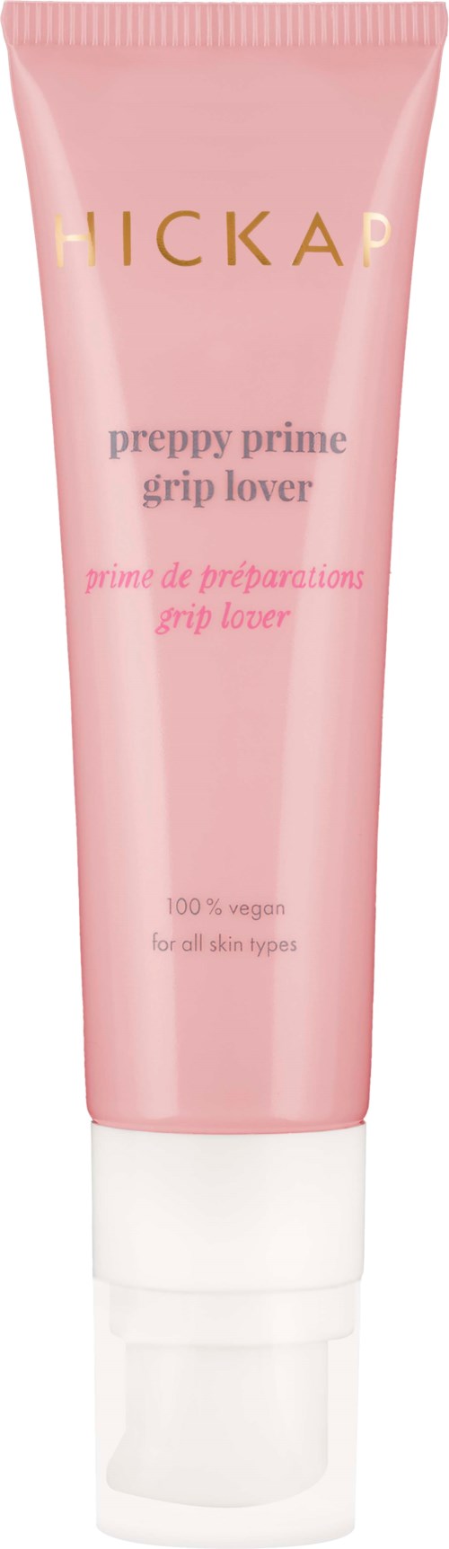 Een roze tube met de tekst 'HICKAP preppy prime grip lover' in goud en roze, rechtop staand.
