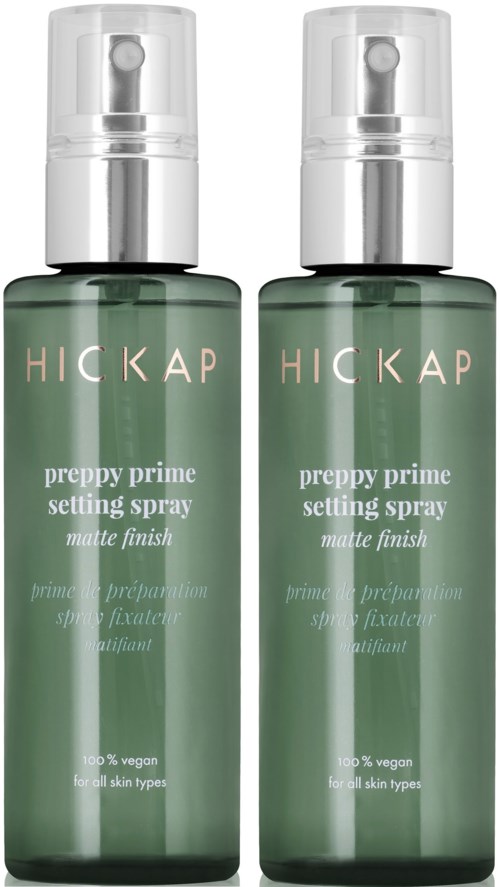 Two green spray bottles labeled 'Hickap preppy prime setting spray' for all skin types, vegan, with matte finish.