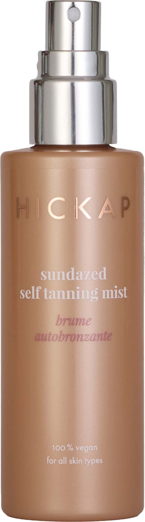 A bottle containing self-tanning mist, labeled Hickap, with a pump top and beige-colored liquid inside.
