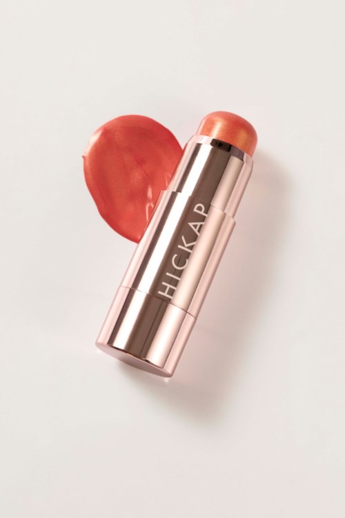 A rose-colored lipstick with the word HICKAP on it, next to a swatch of lipstick on a white background.