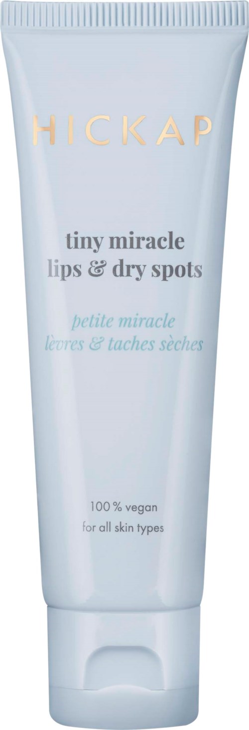 A white tube of lip balm named Hickap, for dry lips and spots, vegan, suitable for all skin types.