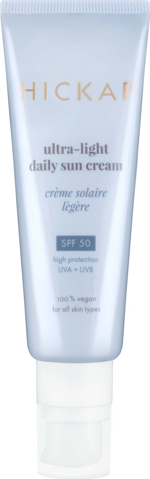 A white tube labeled 'HICKAP ultra-light daily sun cream SPF 50 for all skin types' with protection from UV rays.