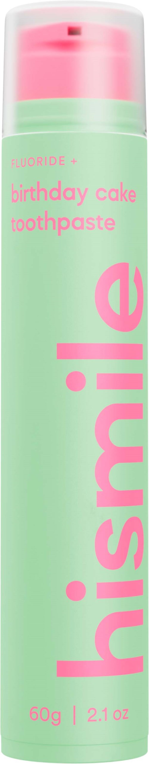 Een klein groen en roze tube met de naam "hishmile" en "birthday cake" tandpasta.