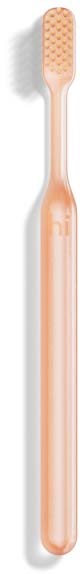 A soft pink toothbrush with a rounded handle and textured bristle area.