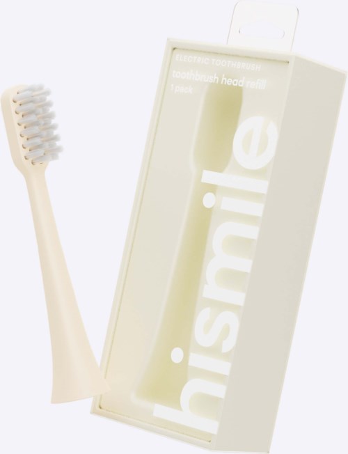 A toothbrush with white bristles and a white handle in front of a white box labeled 'inske'.