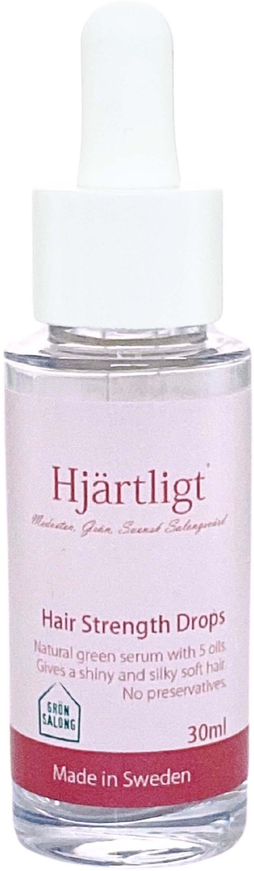 A small bottle of hair drops labeled 'Hjärltigt' with a white cap and pink label, made in Sweden.