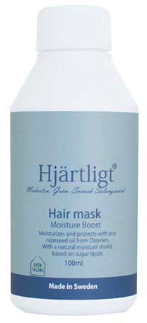 A white bottle with blue label, titled 'Hjärtligt' hair mask, 100ml, made in Sweden, for moisture and protection.