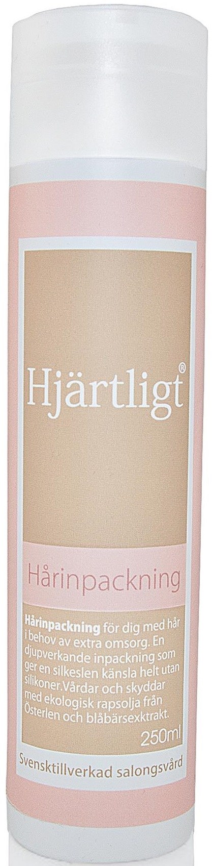 En cilindrisk flaska med rosa och beige etikett, troligen en kräm- eller lotionbehållare, märkt 'Hjärtligt Härinpackning'.