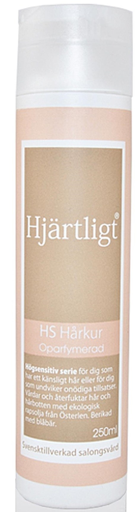 En lång, cylinderformad flaska med etikett i ljus beige och vitt, med text om hjärthälsa och hudvård.