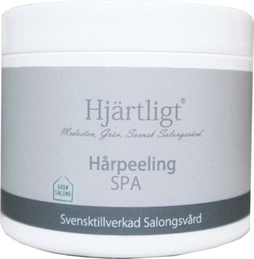Een witte pot met grijs label voor een gezichtspeeling genaamd Hjärtligt, gemaakt in Zweden voor thuisgebruik.