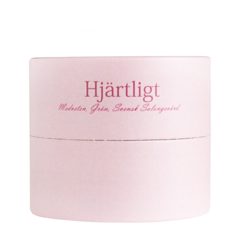 A pink container with Swedish text, likely for a beauty or skincare product.