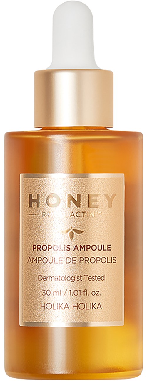Een bruin glazen fles met druppelaar, gelabeld als honing propolis ampul door Holika Holika.