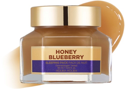 A jar labeled "Honey Blueberry" for sleeping, with cream and purple label, and a spoon of cream beside it.