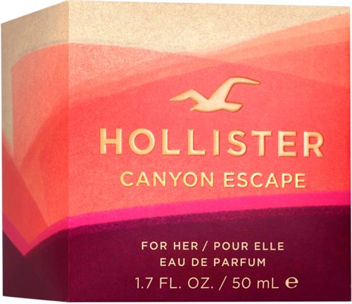 Een zeepverpakking met roze, oranje en paarse kleuren. Het heeft het Hollister-logo en vermeldt de geur Canyon Escape.