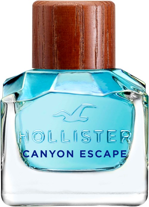 En flaska Hollister Canyon Escape parfym med blå vätska och ett trädkapsel.