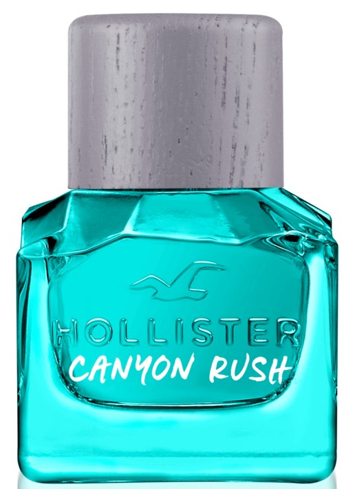Een fles Hollister Canyon Rush parfum met een zilveren dop en heldere blauwe vloeistof.