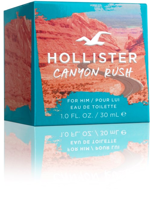 Een aqua blauwe parfumdoos met canyonlandschap, witte meeuwlogo en tekst over Hollister Canyon Rush Eau de Toilette.