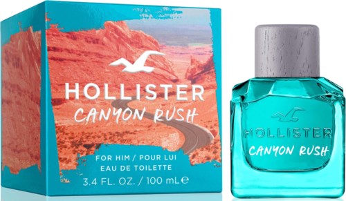 Een parfumbox en fles met oranje en blauwe kleuren, met een weg en een vogel, genaamd 'Hollister Canyon Rush.'
