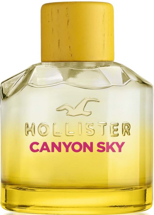 Een glazen parfumfles met een gele dop en gele vloeistof. Het heeft de woorden 'Hollister Canyon Sky' erop.