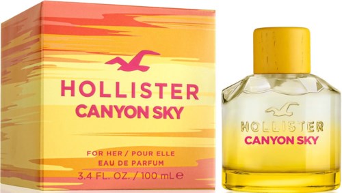 Een parfumfles en doos met roze, geel, oranje kleuren, gelabeld "Hollister Canyon Sky," voor vrouwen.