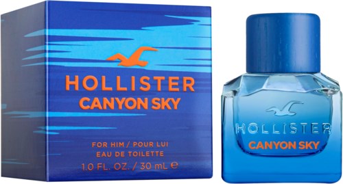 Een blauwe doos en fles Hollister Canyon Sky parfum voor mannen met blauw en oranje design.