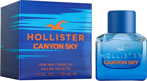 Blauw doosje en fles met oranje logo, naam en beschrijving van herenk parfum genaamd Canyon Sky.