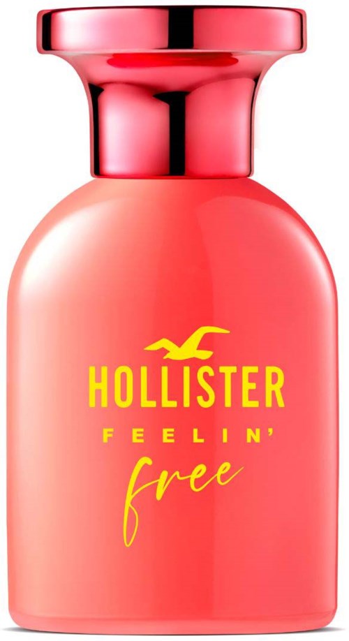 Een roze fles met een glanzende dop, label 'Hollister Feeling Free' in geel en roze tekst.