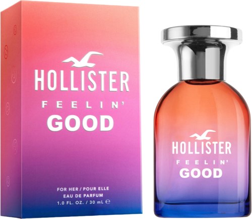 Een parfumdoos en fles met roze en paarse verloop, met Hollister-logo en tekst 'Feelin' Good'.
