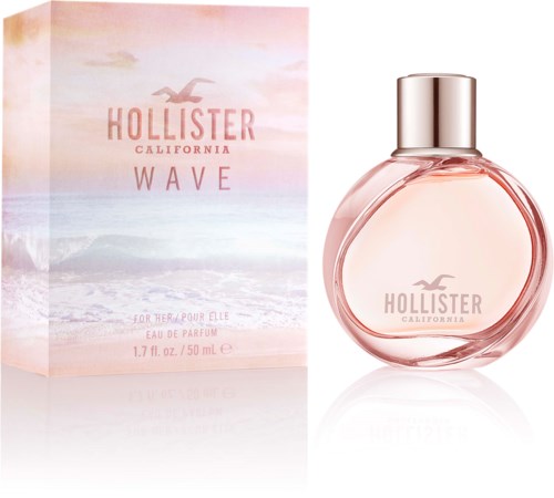 Een flacon parfum genaamd Hollister Wave California naast de doos met strandbeeld en roze lucht.